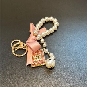 Charm Keychain with Perfume Charm Pearls with pink bow and gold hardware
NWOT
